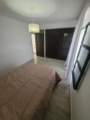 a bedroom with a large bed in a room at Strategic place, close to everything in Villa Carlos Paz