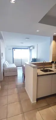a kitchen with a sink and a couch in a room at Rincón Córdoba in Cordoba