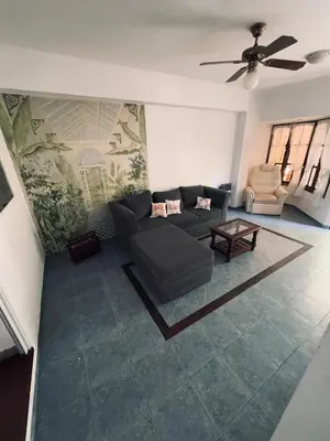 a living room with a couch and a table at Casa Cento in Santa Rosa de Calamuchita