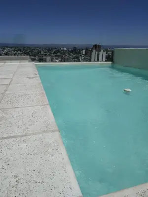 a swimming pool on the roof of a building at Skyline Córdoba in Cordoba