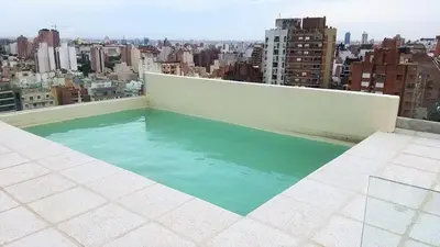 a swimming pool on the roof of a building at Skyline Córdoba in Cordoba