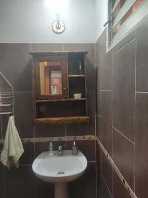a bathroom with a sink and a mirror at Don Sabino in Arroyo de Los Patos