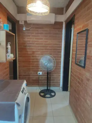 a kitchen with a fan in the corner of a room at Don Sabino in Arroyo de Los Patos