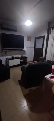 a living room with a large flat screen tv at Casa centrica con Piscina in Mina Clavero
