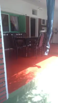 a dining room with chairs and a table in a building at Casa centrica con Piscina in Mina Clavero