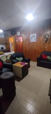 a living room with couches and a table at Casa centrica con Piscina in Mina Clavero