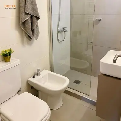 a bathroom with a shower and a toilet and a sink at Av Velez Sarsfield B Nueva Córdoba in Cordoba