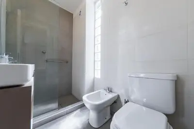 a bathroom with a toilet and a shower and a sink at Av Velez Sarsfield B Nueva Córdoba in Cordoba
