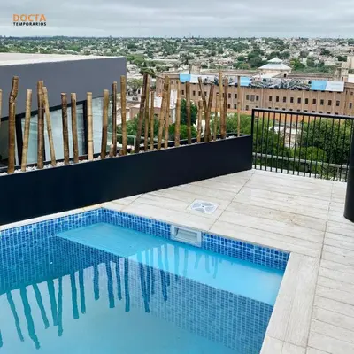 a swimming pool on top of a building at Av Velez Sarsfield B Nueva Córdoba in Cordoba