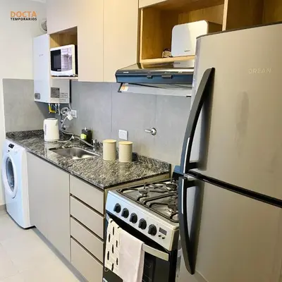 a kitchen with a refrigerator and a stove and a sink at Av Velez Sarsfield B Nueva Córdoba in Cordoba