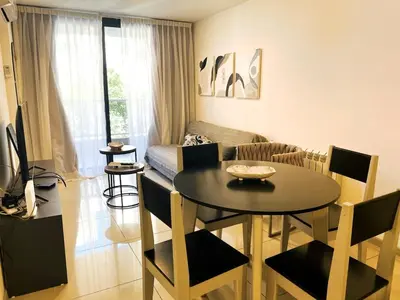 a living room with a table and a couch at Av Estrada 48 B Nueva Córdoba in Cordoba