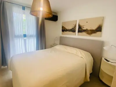 a bedroom with a white bed and a window at Arturo M Bas B Güemes in Cordoba