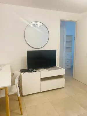 a white desk with a mirror on the wall at Arturo M Bas B Güemes in Cordoba