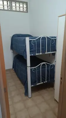 two bunk beds in a room with a doorway at Casa Ayeya in Villa Carlos Paz