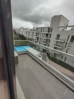a view of a swimming pool from a balcony of a building at Sam 1 Sampaoli in Villa Carlos Paz