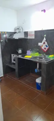 a kitchen with a sink and a counter top at Todo cerca in Mina Clavero