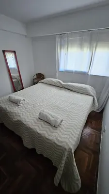 a bedroom with a bed with a towel on it at Apartamento en Nueva Córdoba in Cordoba