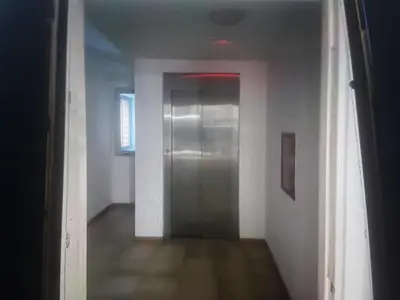 a hallway with a silver elevator in a room at Cielos de Güemes in Cordoba