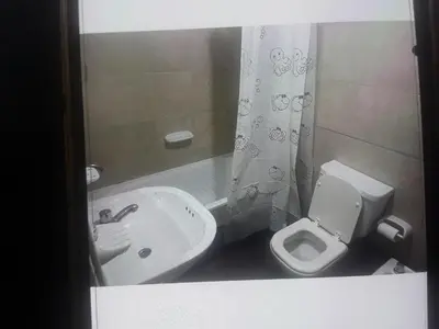 a small bathroom with a toilet and a sink at Cielos de Güemes in Cordoba