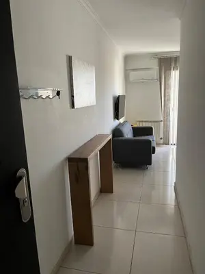 a living room with a couch and a table at Two paxs in Cordoba