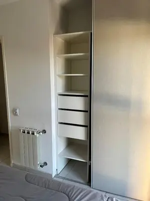 a closet with a mirror next to a bed at Two paxs in Cordoba