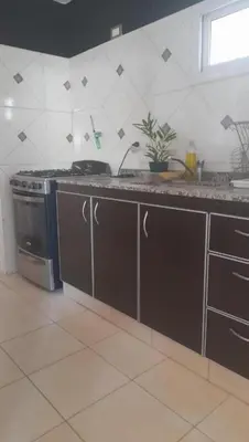 a kitchen with a sink and a stove at Casa Valle Buena Esperanza in Alta Gracia