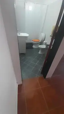 a bathroom with two toilets and a sink at Casa Valle Buena Esperanza in Alta Gracia