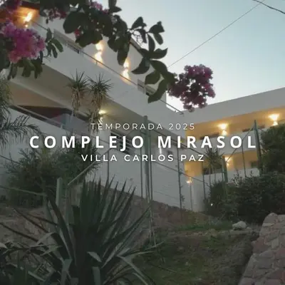 a building with a sign that reads compilado mirabella villa gardensaza at Complejo Mirasol en Carlos Paz in Villa Carlos Paz