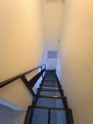 a staircase in a room with a stair case at Duplex en complejo in Villa Carlos Paz