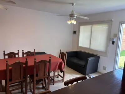 a dining room with a table and a couch at A carlos paz voy in Villa Carlos Paz