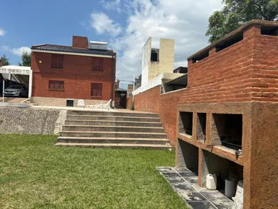 a brick building with stairs in front of a building at A carlos paz voy in Villa Carlos Paz