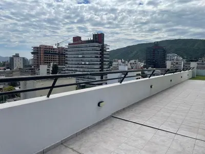a balcony with a view of a city at Centro Carlos Paz Cibeles in Villa Carlos Paz