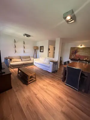 a living room with a couch and a table at Departamento Córdoba IV, estadio Kempes, Siglo 21,Cerro de las Rosas, Chateau in Cordoba