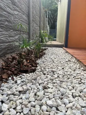 a rock garden in front of a building at La Petrona in Alta Gracia