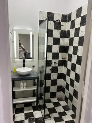 a bathroom with a sink and a mirror at La Petrona in Alta Gracia