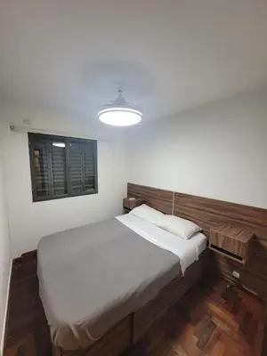 a bedroom with a large bed and a window at Departamento en Cordoba in Cordoba