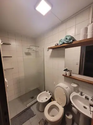 a bathroom with a toilet and a sink and a shower at Departamento en Cordoba in Cordoba