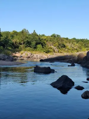 a river with some rocks in the water at Casa Ortiz in Villa Canada del Sauce
