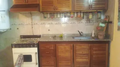 a kitchen with a sink and a stove at EL Sol in Cordoba
