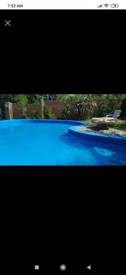 a television screen with a picture of a swimming pool at Monoambiente con piscina compartida in Mina Clavero