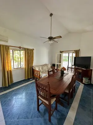 a living room with a wooden table and a couch at El GOLF in Alta Gracia