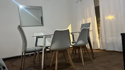 a dining room with a table and four chairs at CENTRO CORDOBA departamento 2 dormitorios in Cordoba
