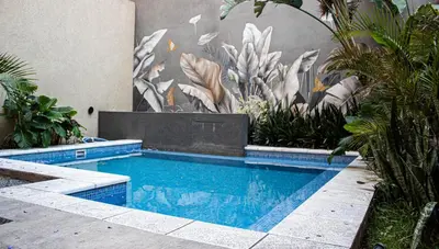 a swimming pool in front of a wall with a mural at El Nuevo Obispo, ubicación 5 estrellas, balcón y pileta in Cordoba