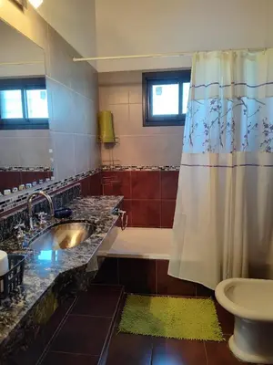 a bathroom with a sink and a tub and a shower at La Aurora in Merlo
