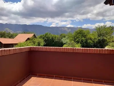 a balcony with a view of the mountains at La Aurora in Merlo