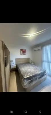 a bedroom with a large bed in a room at Departamento Miralejos 16 in Villa Carlos Paz