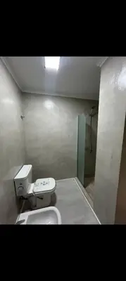 a small bathroom with a toilet and a shower at Departamento Miralejos 16 in Villa Carlos Paz