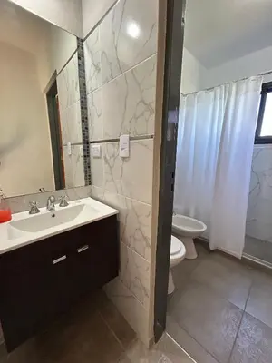 a bathroom with a sink and a toilet at Refugio de las Nubes in Las Rabonas