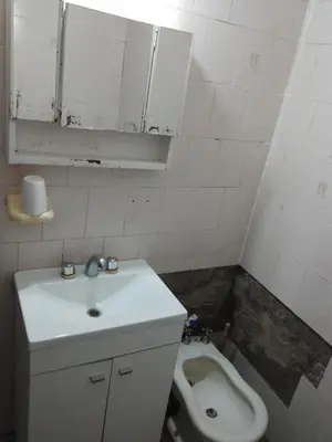 a bathroom with a sink and a toilet at Dpto Bordo in Villa Cura Brochero