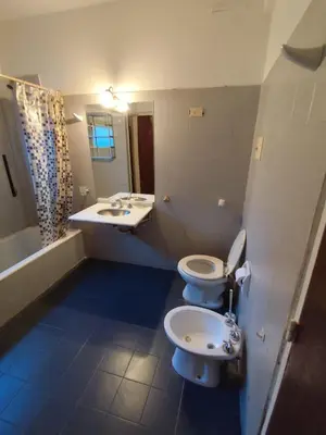 a bathroom with two toilets and a sink at Salguero Centric Apartament D4 in Cordoba